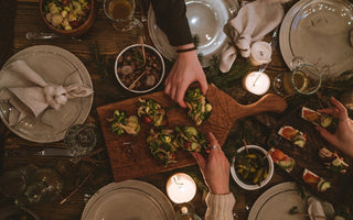 Keto holiday dinner table with healthy low-carb appetizers and festive holiday decorations.