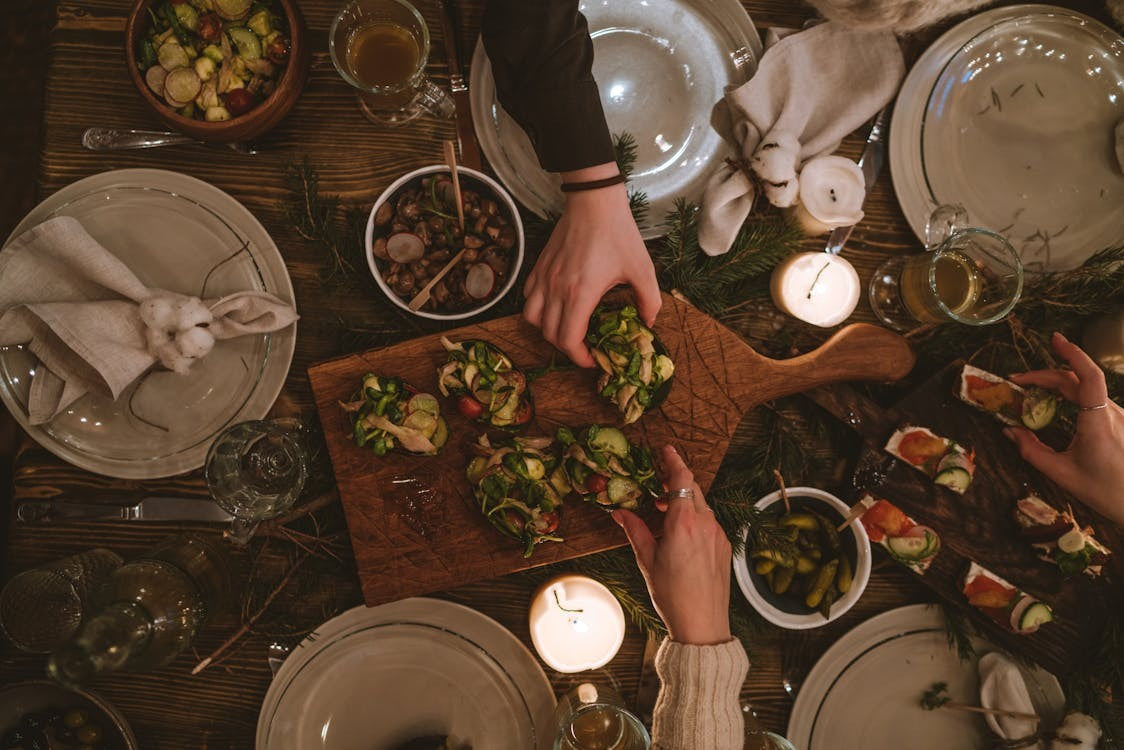 Keto holiday dinner table with healthy low-carb appetizers and festive holiday decorations.